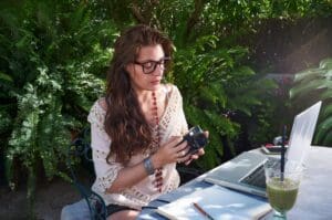 A,Young,Woman,Dressed,Casually,Enjoys,Nature,While,Working,With