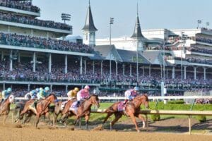 TravMedia_United_Kingdom_medium-sized_1663126_Churchill_Derby_Horses_Jockey_First_Turn_Spires