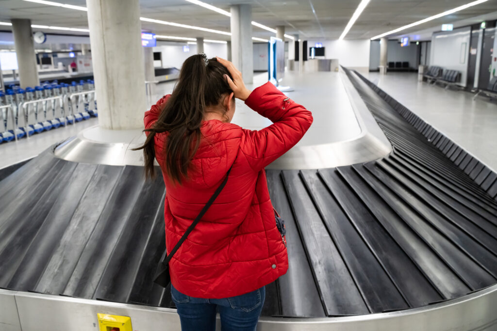 Upset,Woman,Lost,Baggage,While,Traveling,By,Plane