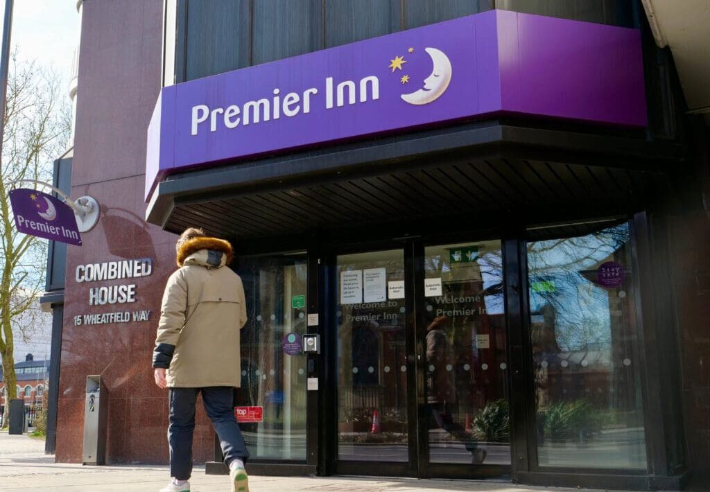 Whitbread, the owner of budget hotel chain Premier Inn, has reported steady sales in the UK alongside a surge in its German operations during the latest trading period.