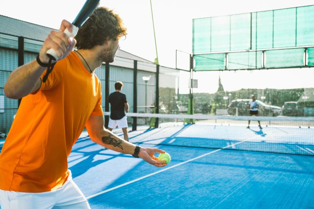 Mixed,Padel,Match,In,A,Blue,Grass,Padel,Court,-