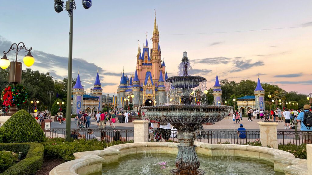 People walking toward Cinderella Castle during Christmas at Walt