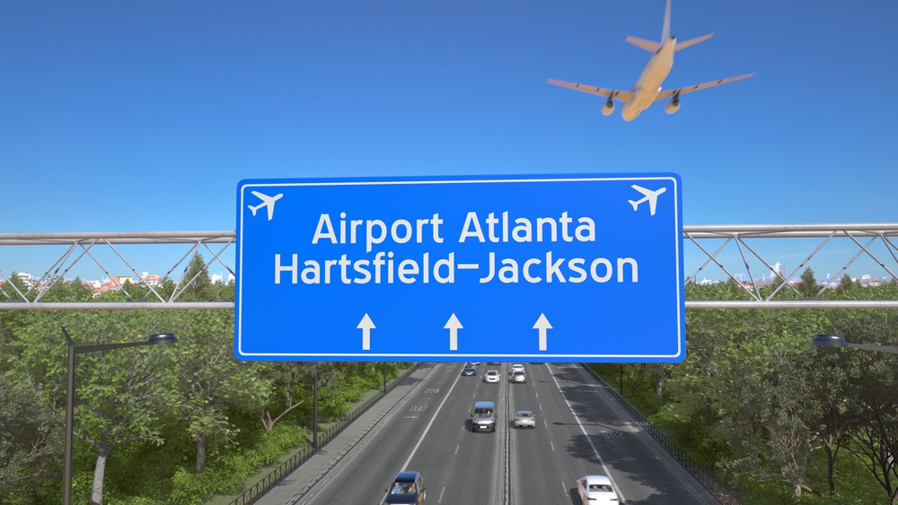 Blue,Motorway,Sign,For,Atlanta,Hartsfield,Jackson,Airport,With,An
