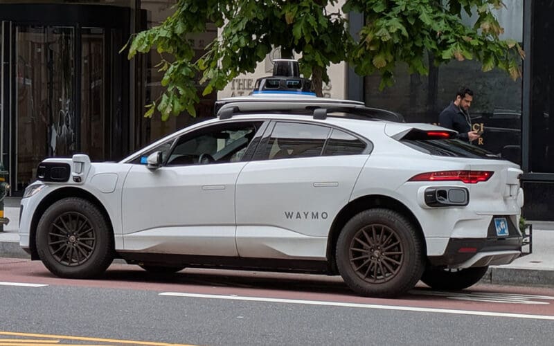 Waymo to Launch Fully Autonomous Ride‑Hailing in Munich as Germany Backs Robotaxi Expansion Waymo has confirmed that Munich will become its first German launch city, laying the groundwork for a fully autonomous ride‑hailing service that is expected to open to the public in late 2027. The company says the move marks a major milestone in its global expansion, bringing its technology — already used for more than 20 million autonomous trips — to one of Europe’s most influential mobility hubs. In the coming weeks, Munich residents will begin seeing Waymo vehicles on local streets, though they will initially be driven manually as part of a phased testing programme. This early stage includes high‑definition mapping and on‑road validation with trained autonomous specialists behind the wheel to ensure the Waymo Driver adapts to Munich’s specific traffic patterns and road conditions. Waymo co‑CEO Tekedra Mawakana said joining Munich represents an “important milestone” for the company, emphasising that community trust, safety and local job creation will be central to the rollout. Waymo plans to invest in fleet operations and hire high‑skilled staff as it prepares for commercial service. Germany Welcomes Autonomous Mobility German officials have strongly endorsed Waymo’s arrival. Parliamentary State Secretary Christian Hirte said autonomous driving is “key to the mobility of the future,” noting that Germany has already established a legal framework to support commercial robotaxi operations. He added that Waymo’s decision to enter the German market demonstrates the country’s attractiveness for autonomous mobility innovation and manufacturing. Bavaria’s State Chancellery echoed the sentiment, calling Munich an ideal high‑tech location thanks to its automotive industry, research institutions and AI ecosystem. Officials say they will work to reduce regulatory barriers and accelerate the transition from testing to real‑world deployment. Safety and Accessibility at the Core Waymo says safety will remain its top priority as it collaborates with local, state and federal authorities on approvals. The company highlights data from 350 million fully autonomous kilometres, showing 16 times fewer serious injury crashes, 14 times fewer pedestrian injury crashes, and 6 times fewer cyclist injury crashes compared with human drivers. Advocates for blind and visually impaired travellers have welcomed the launch, saying autonomous vehicles could remove barriers often encountered with traditional taxi services and offer greater independence for guide‑dog users. A New Chapter for Munich’s Mobility Landscape Waymo says its service will complement Munich’s existing public transport, cycling and pedestrian networks, contributing to a more integrated and sustainable urban mobility ecosystem. As testing begins and regulatory work continues, the company says it “can’t wait” for residents and visitors to experience autonomous ride‑hailing in the city for the first time.