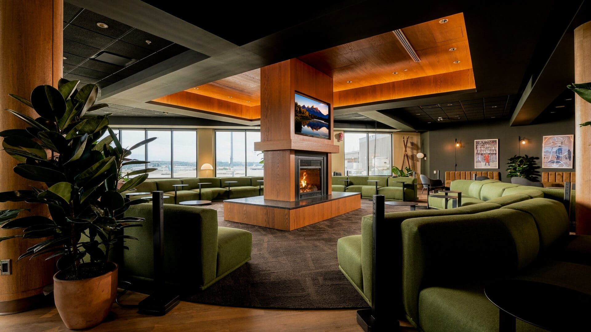 Seating and wood panelling inside the Calgary airport Amex lounge in Concourse A at YYC