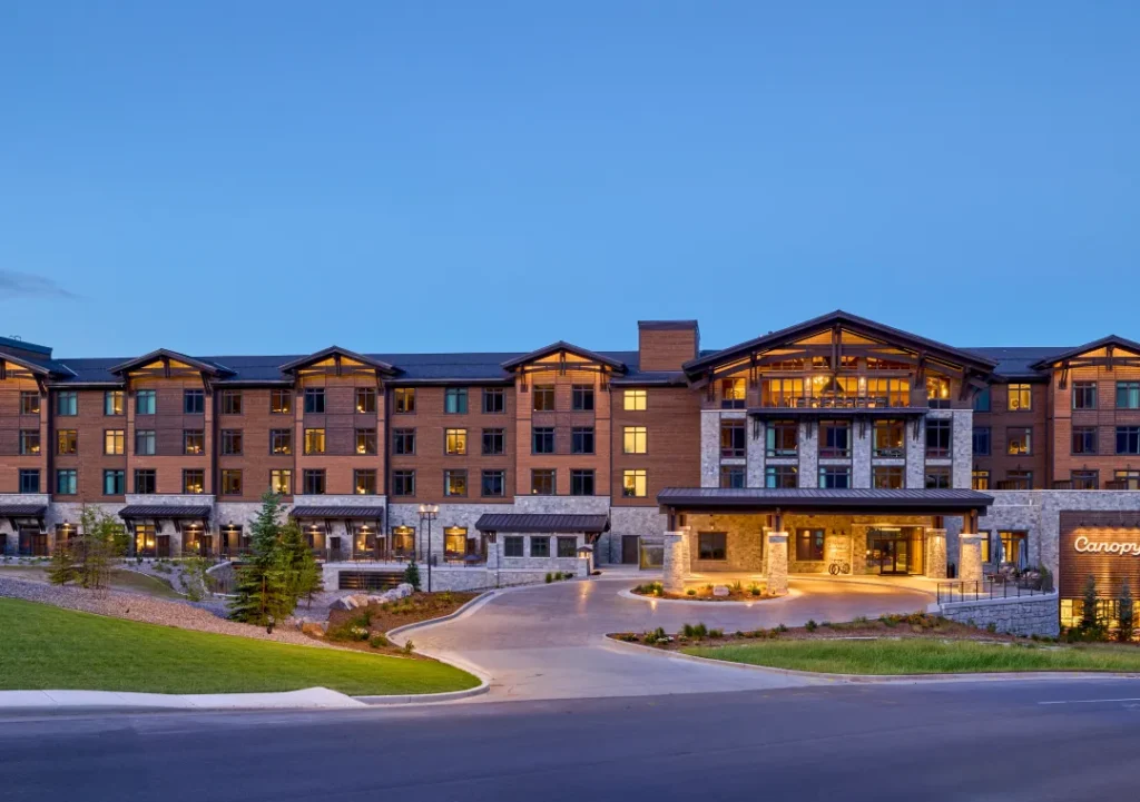 Canopy Deer Valley exterior in stone and wood at the base of Deer Valley Resort in Park City, Utah