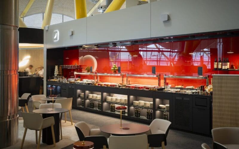Circular bar and seating inside the Iberia Emerald Lounge at Madrid Barajas Terminal 4