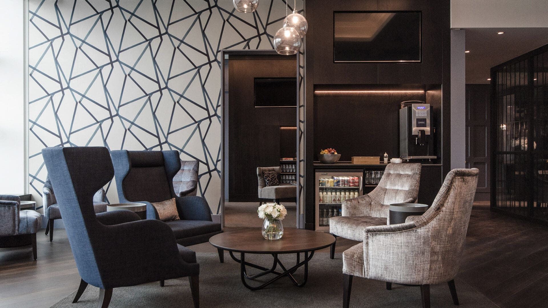 Table seating and bar inside the Clubrooms Gatwick South lounge at London Gatwick airport
