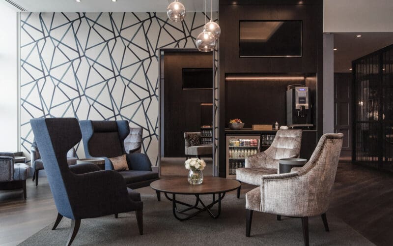 Table seating and bar inside the Clubrooms Gatwick South lounge at London Gatwick airport