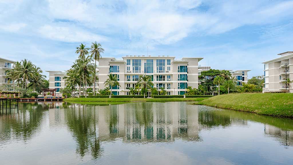 Beachfront pool and villas at Rixos Water World Phuket on Mai Khao beach, Thailand