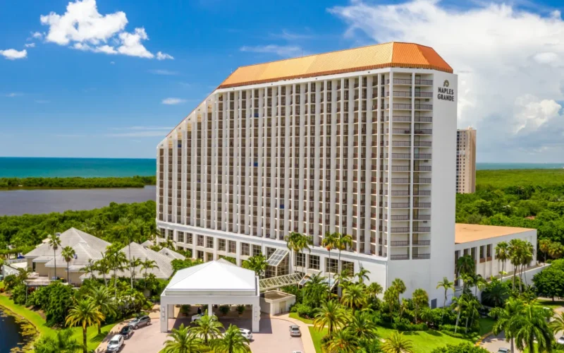 Signia Hilton Naples Grande beachfront resort and pool deck on Florida's Gulf Coast