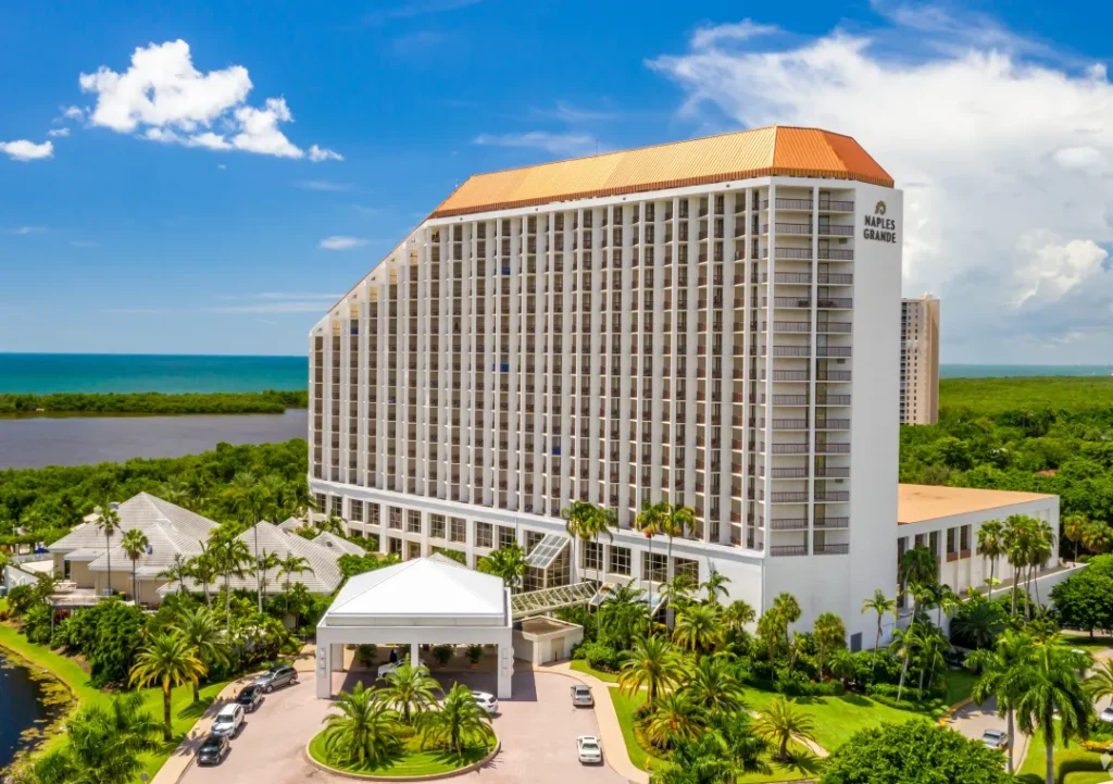 Signia Hilton Naples Grande beachfront resort and pool deck on Florida's Gulf Coast