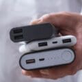 Power bank and smartphone on an aircraft seat tray, with airline power bank rules limiting passengers to two
