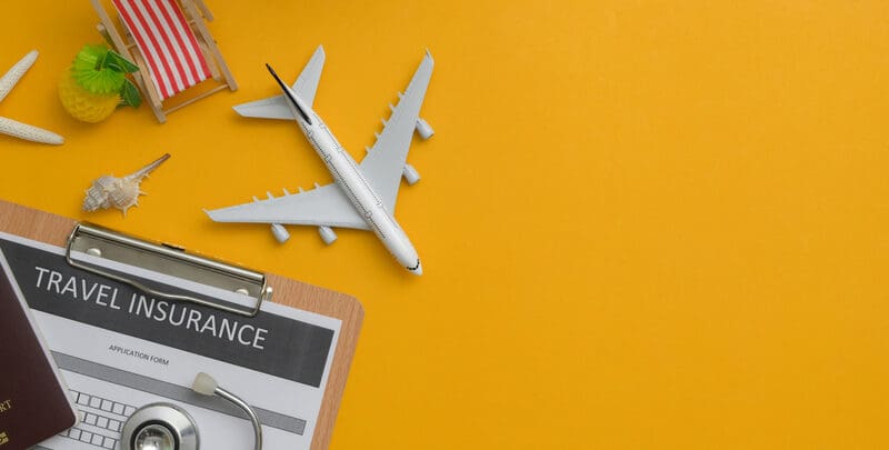 Travel,Insurance,Concept,:,Travel,Insurance,Form,On,Clipboard,,Stethoscope,